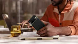 man holding Pixel 8 smartphone