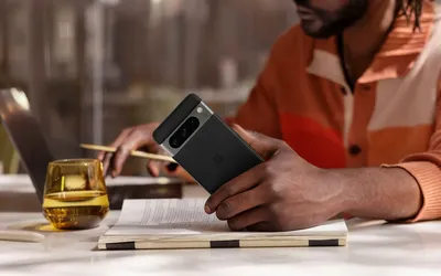 man holding Pixel 8 smartphone