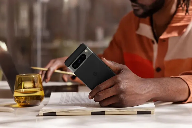 man holding Pixel 8 smartphone