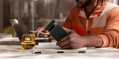man holding Pixel 8 smartphone