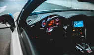 black car steering wheel during daytime